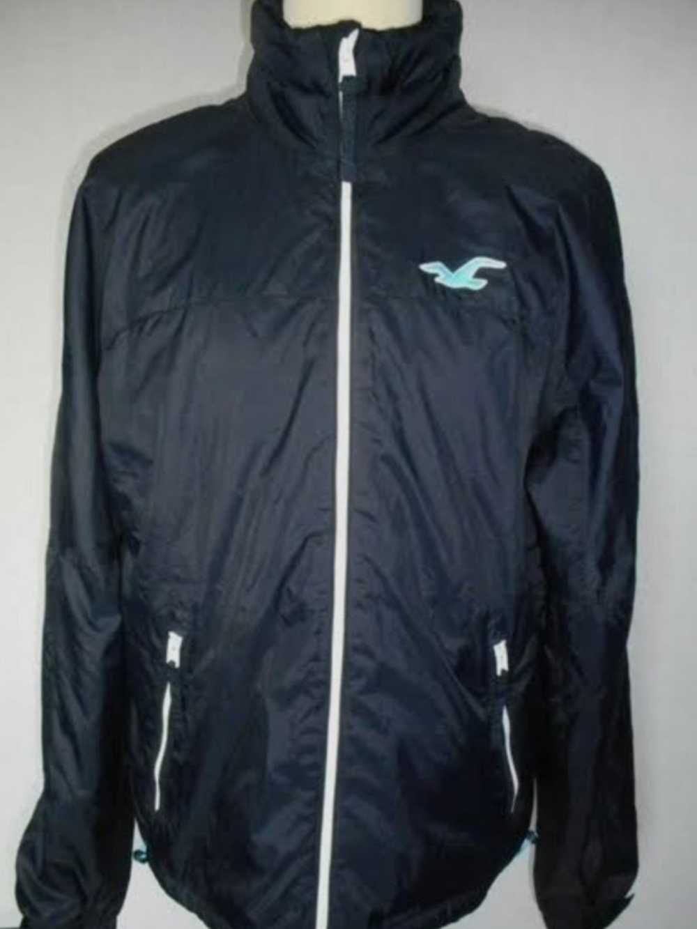Hollister Navy Windbreaker with White Trim and Aqua Logo
